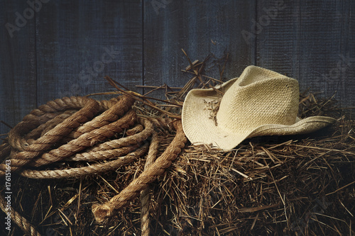 Western straw hat on a bale of hay photo