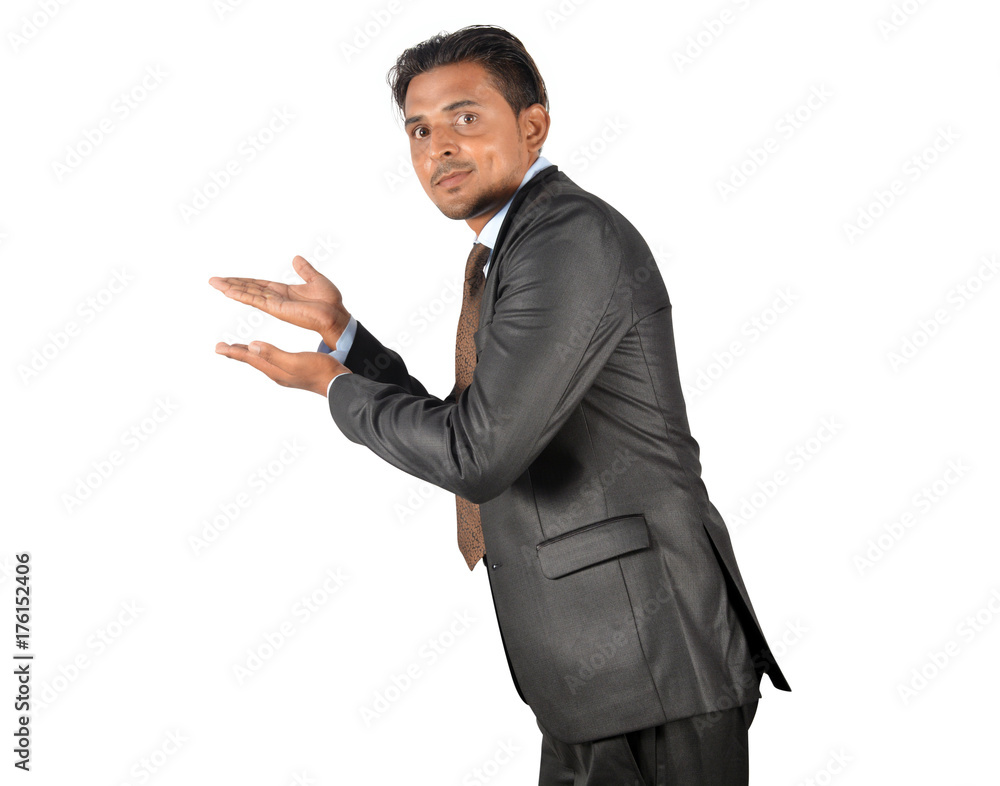 Businessman in black suit pointing away over white background Businessman in black suit pointing away over white background
