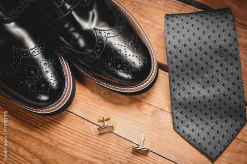 Male accessories. Shoes with tie and cuff