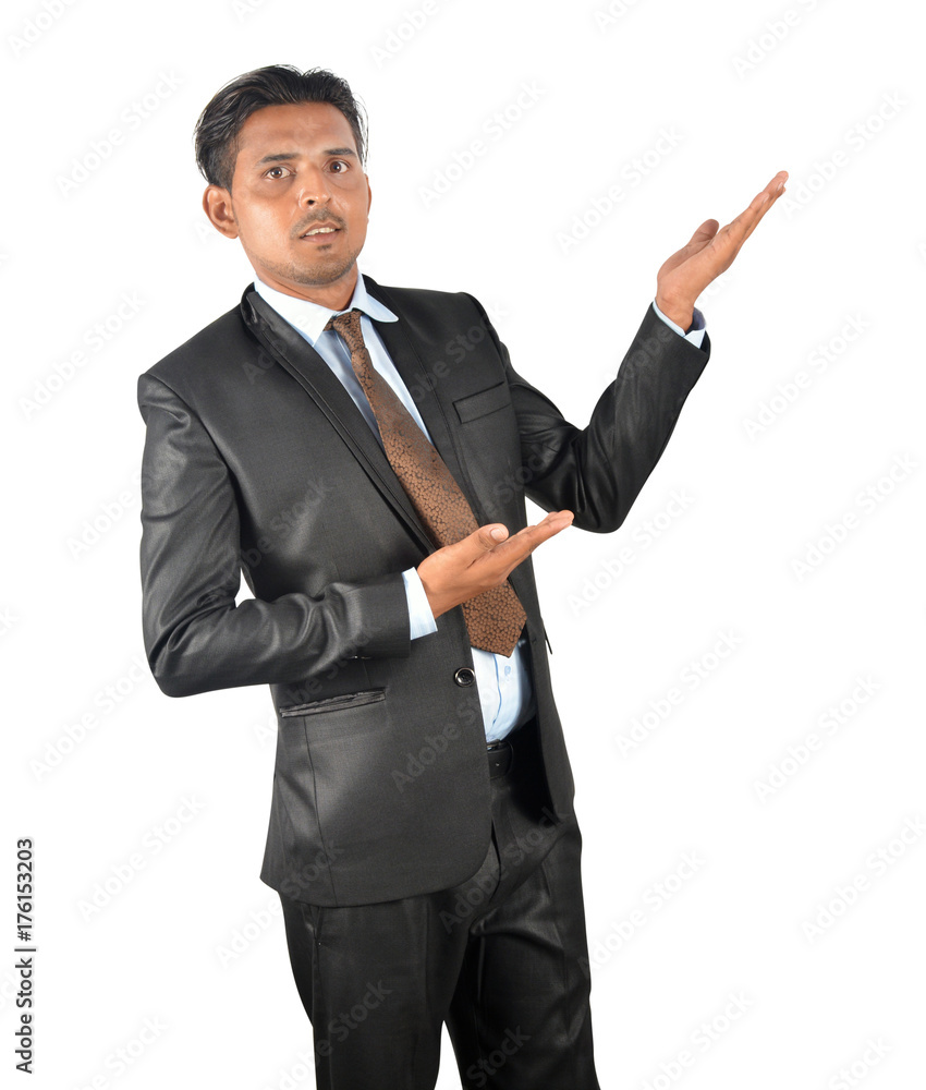 Businessman in black suit presenting and showing over white background Businessman in black suit presenting and showing over white background