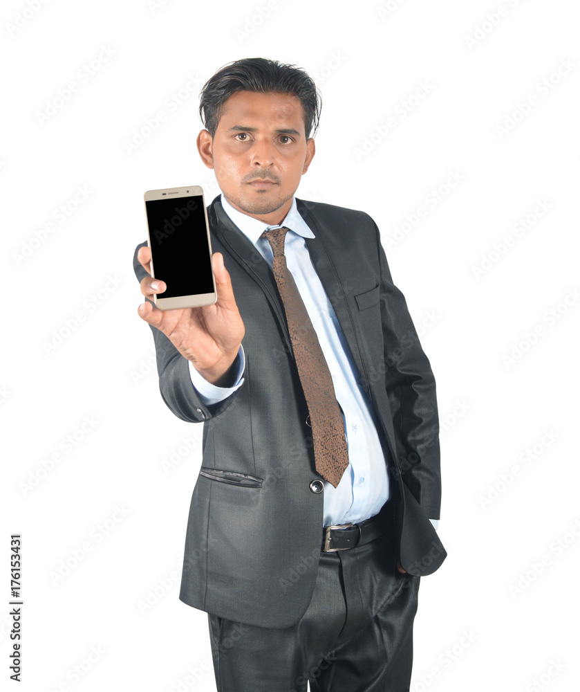 Businessman in black suit showing mobile screen over white background Businessman in black suit showing mobile screen over white background