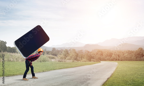 Builder man carry huge smartphone