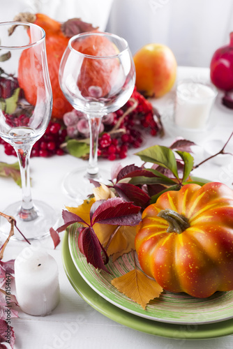 Autumn table setting with pumpkins.