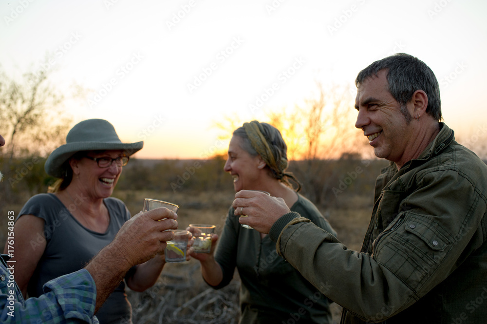 Friends having sundowners Friends having sundowners