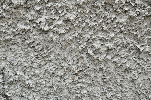 Texture of rough plastered gray wall
