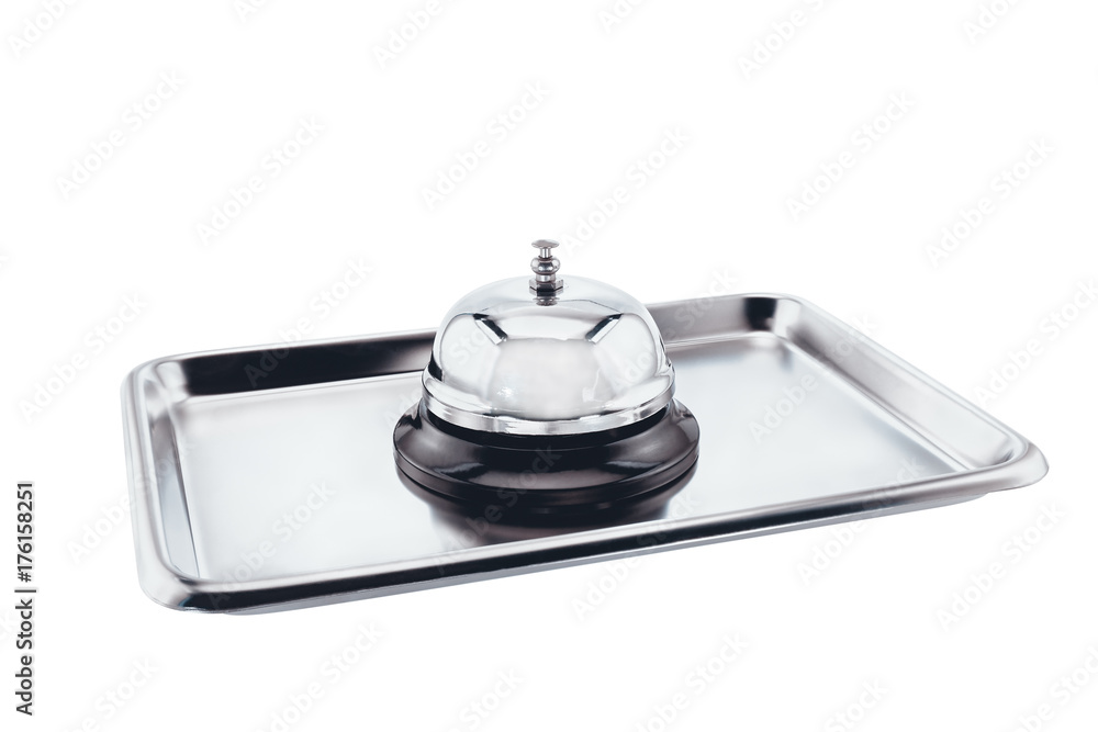 Service bell / Service bell on stainless tray on white background. Service bell / Service bell on stainless tray on white background.