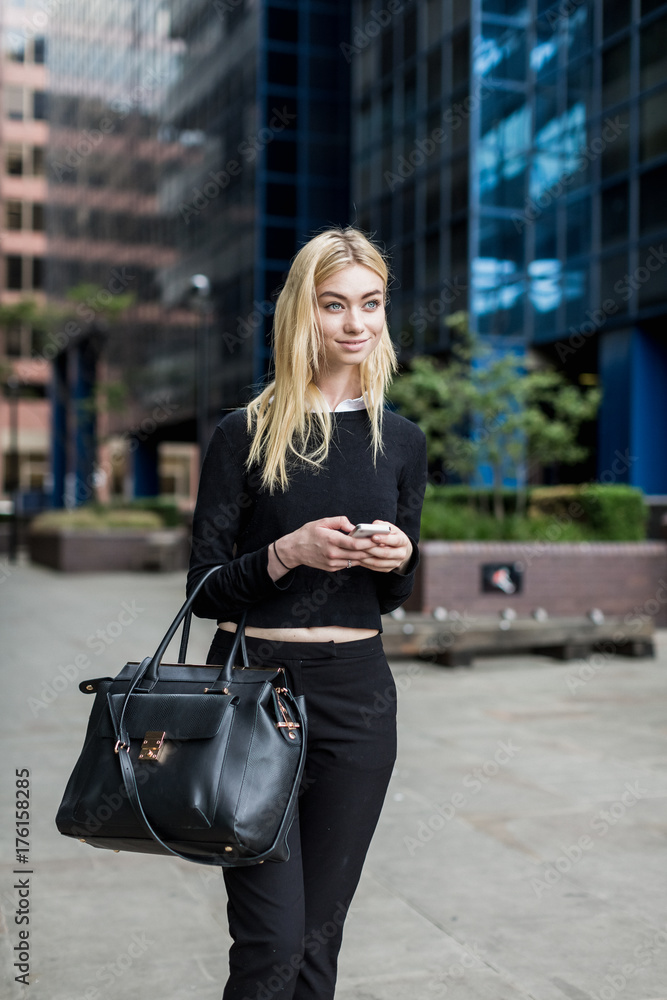 Business woman using a smartphone outdoor Business woman using a smartphone outdoor