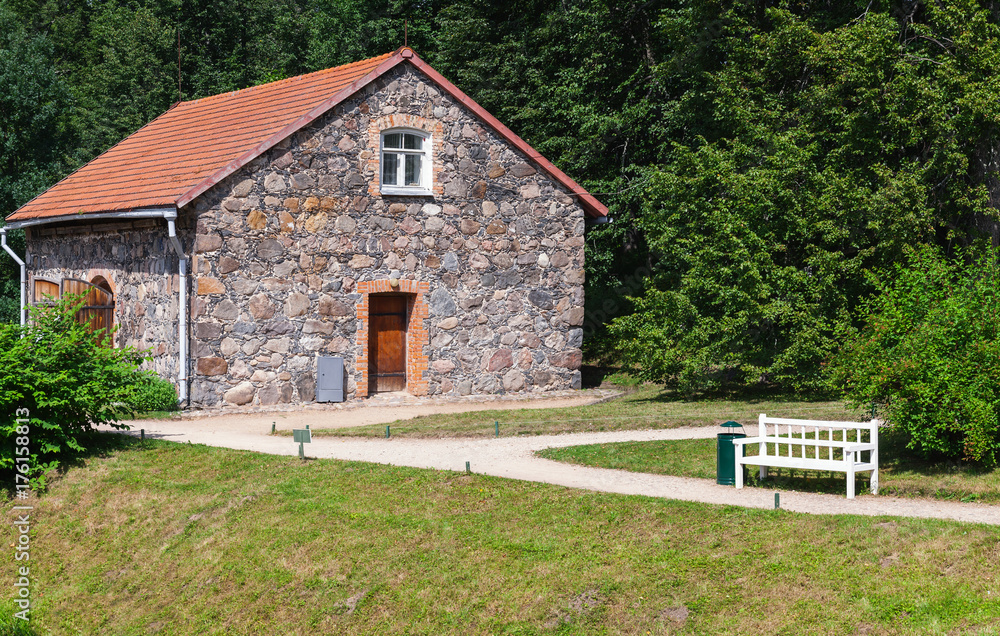 Landscape with old stone house and bench Landscape with old stone house and bench
