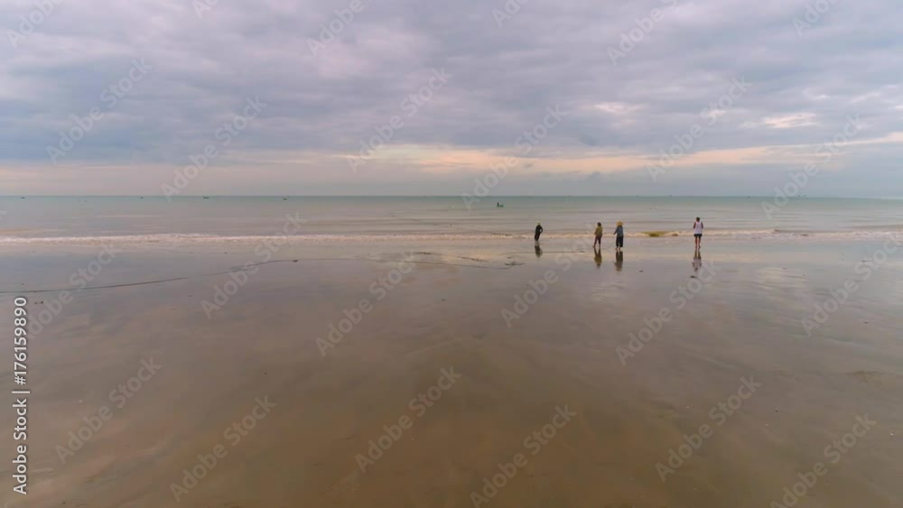 Mui Ne Vietnam Locals and tourist on the bech Aerial view Cloud sky Fishing Mui Ne Vietnam Locals and tourist on the bech Aerial view Cloud sky Fishing