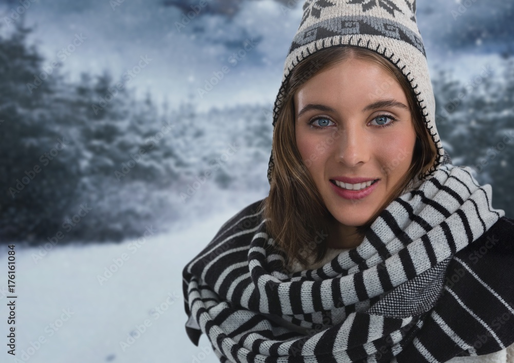 Woman with scarf and hat in snow forest at night Woman with scarf and hat in snow forest at night