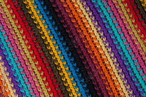 texture of a striped knitted multicolored sweater © katjabakurova