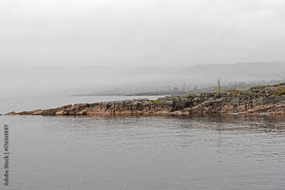 The shores of Lake Ladoga, hidden by fog. Karelia, Russia.