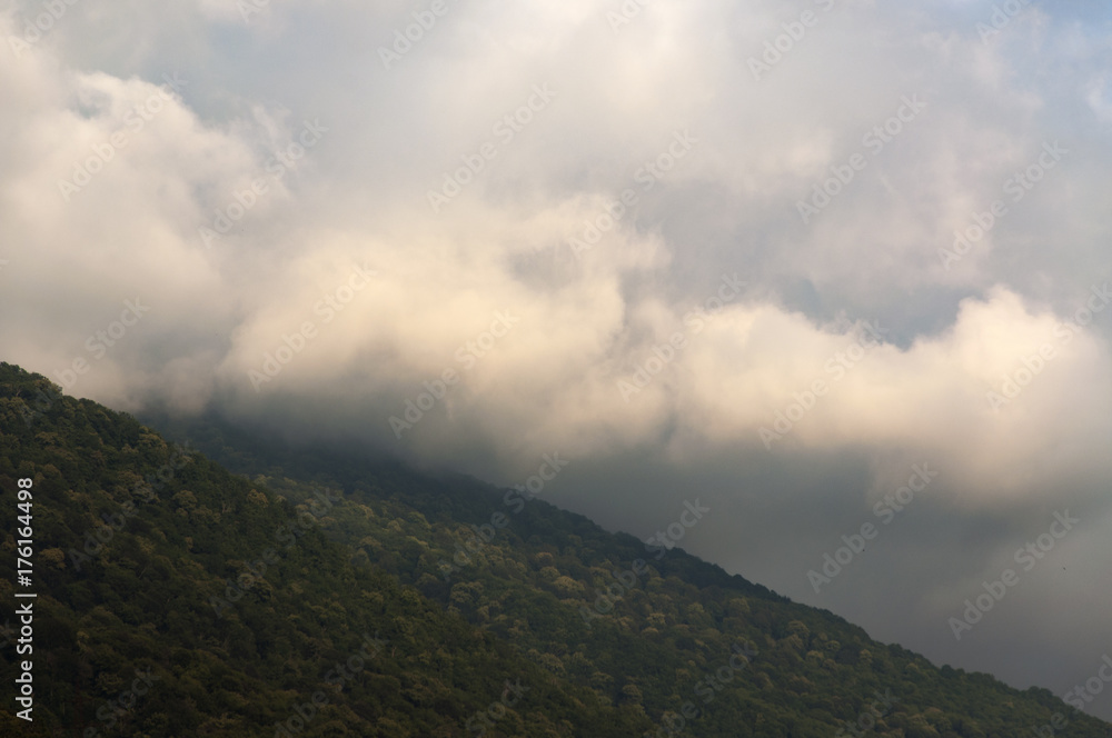 Clouds coming down from the mountains