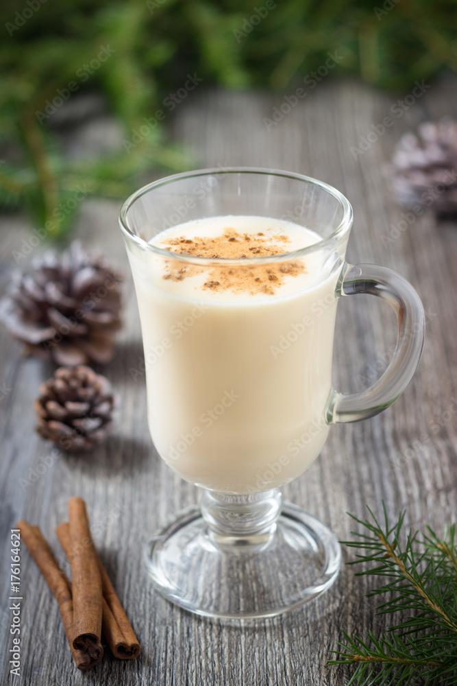 Homemade eggnog with cinnamon for Christmas and winter holidays Homemade eggnog with cinnamon for Christmas and winter holidays