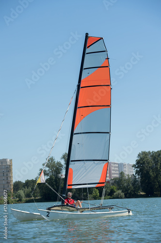 sailing on a lake - summer and sports theme photo