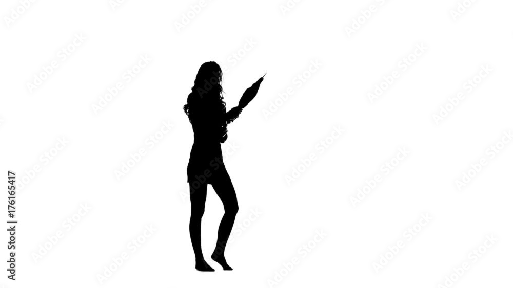 Girl opens an umbrella and raises her leg up. White background. Silhouette Girl opens an umbrella and raises her leg up. White background. Silhouette