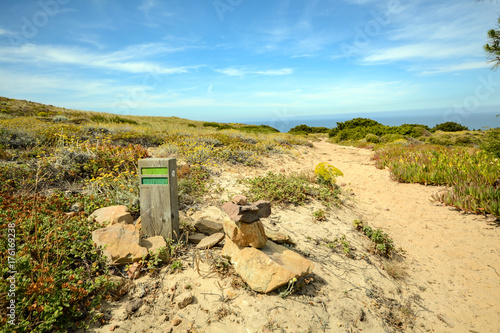 Hiking trail Rota Vicentina from Odeceixe to Zambujeira do Mar through Alentejo landscape, Portugal photo