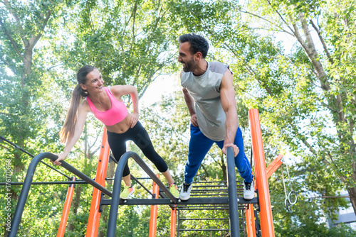 Photos Low-angle view of a young fit woman and her partner smiling while practicing pla