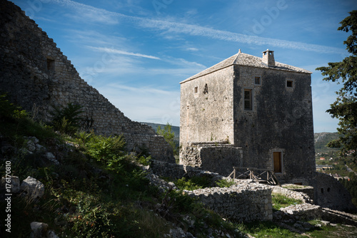 old stone wall with stone house in fortress