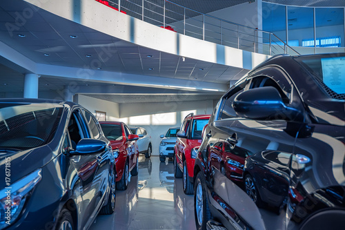 New cars at dealer showroom photo
