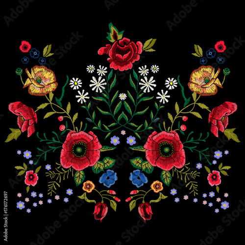 Embroidery traditional pattern with red poppies and roses.