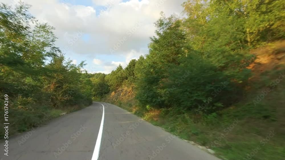 Convertible car drive pov on curved road in mountains Convertible car drive pov on curved road in mountains
