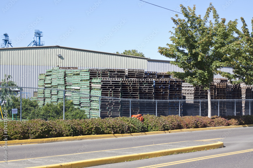 Wooden pallets in front of large building