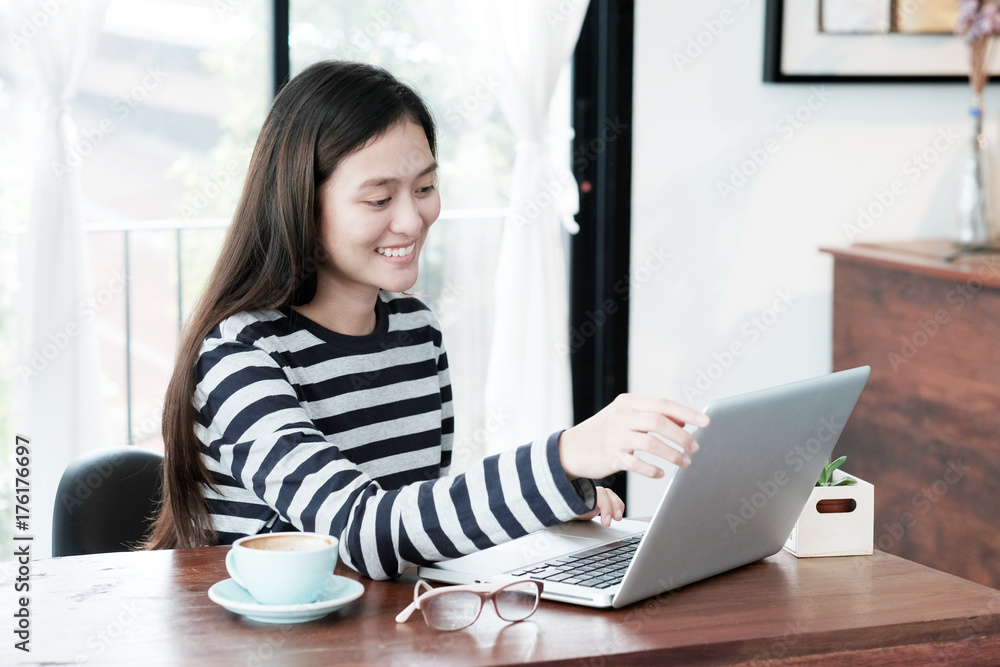 Young asian woman using laptop computer in casual lifestyles, people and technology, lifestyles Young asian woman using laptop computer in casual lifestyles, people and technology, lifestyles