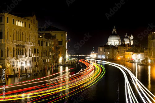Grand Canal and Basilica Santa Maria della Salute, Venice, Italy at night with light trails. View from Accademia bridge