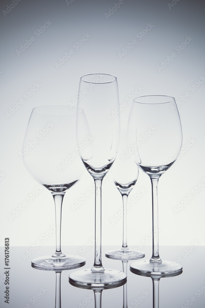 Glassware selection with wine, champagne and liquour glasses  on the light background