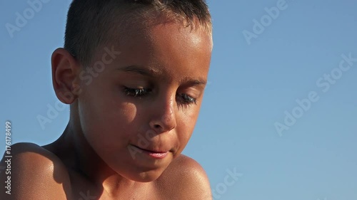 Hispanic boy shivering with cold. Intense cold