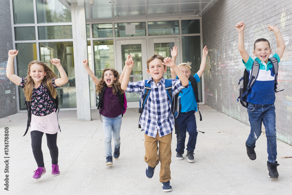 Great group Portrait Of School Pupil Outside Classroom Carrying Bags