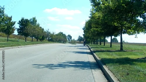 A Journey: Man Walking on Boulevard with Shirt Unbuttoned (Frontside) photo