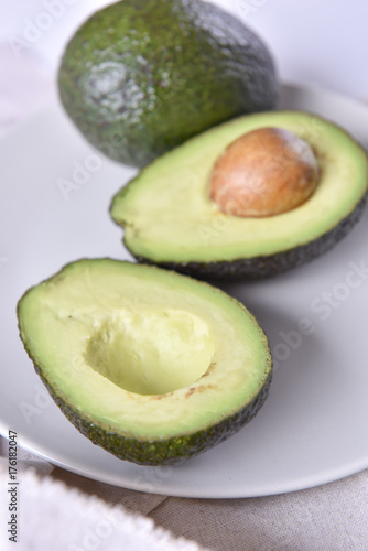 Ripe avocado on a plate.
