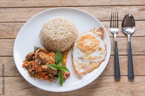 Stir fried pork with chili and basil, served with steamed rice and fried egg,Pad Kra-prao,Thai style food
