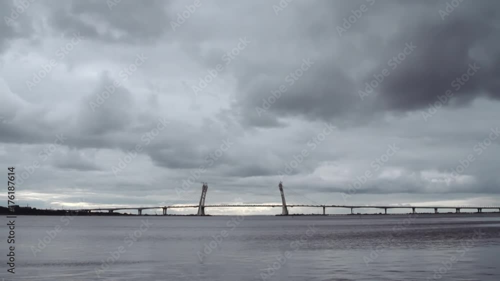 Suspension highway bridge over sea gulf under cloudy sky on cold day, panoramic shot Suspension highway bridge over sea gulf under cloudy sky on cold day, panoramic shot