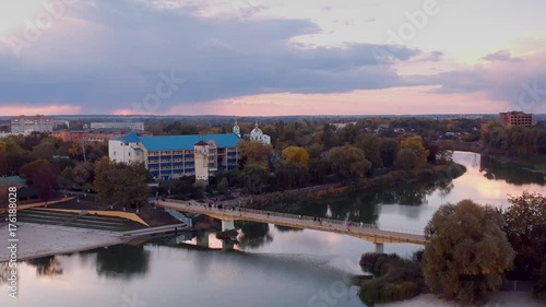 Aerial view on Mirgorod city, Ukraine. Old video style, low light evening sunset autumn footage photo