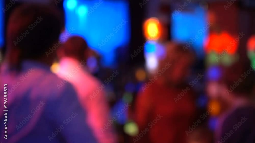 Blurred image of the dance floor in a restaurant or nightclub. Defocused people are dancing. Blurred image of the dance floor in a restaurant or nightclub. Defocused people are dancing.