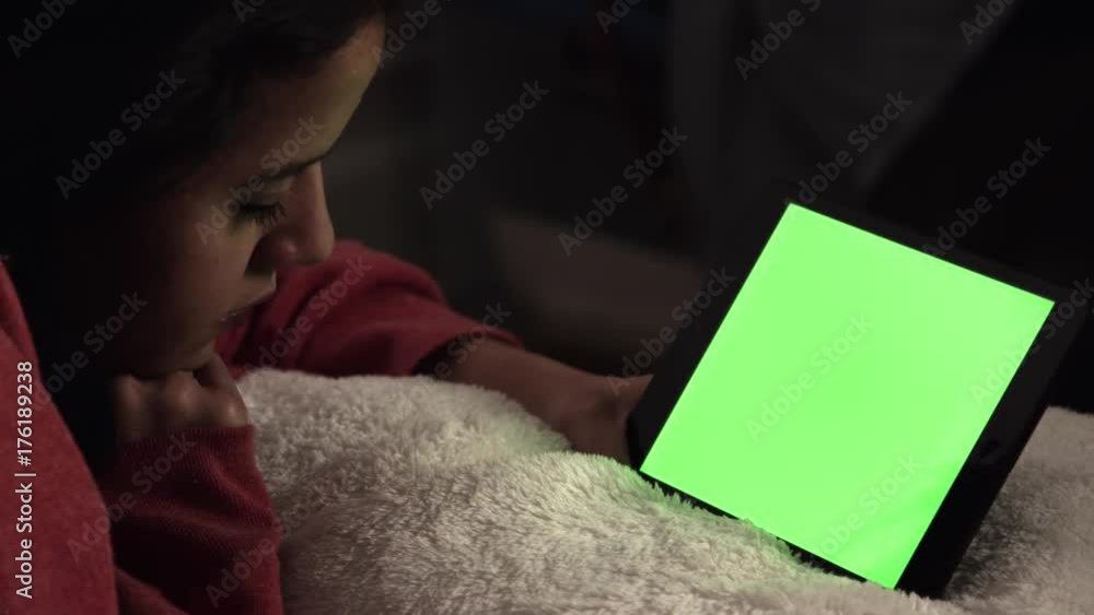 Woman watching tablet with green screen Woman watching tablet with green screen