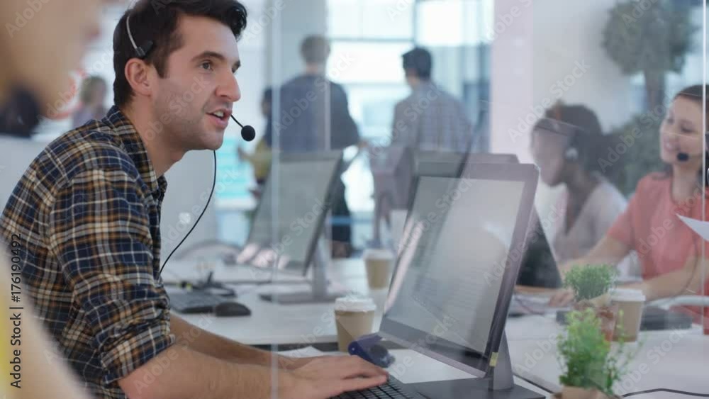 Mixed ethnicity telesales team working together in busy call center Mixed ethnicity telesales team working together in busy call center