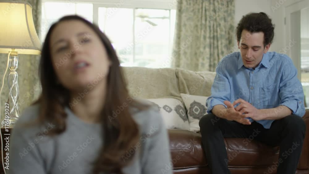 Couple with relationship problems having emotional conversation at home