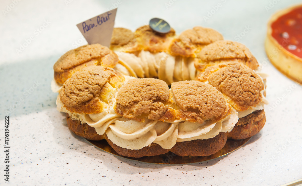 Delicious french cake Paris Brest on a showcase