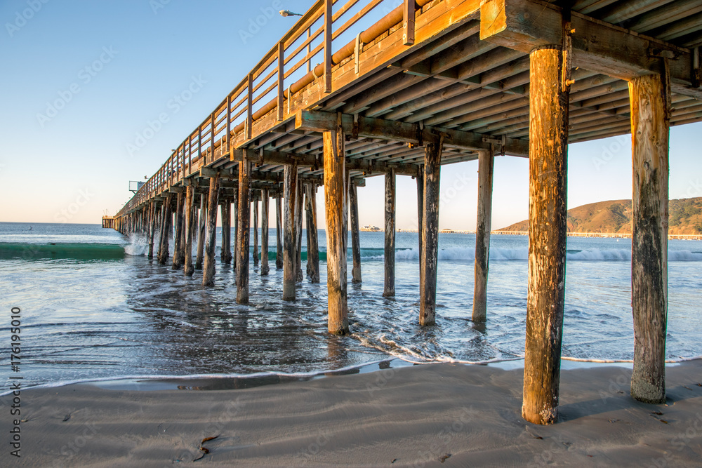 Avila Beach pier view under with waves