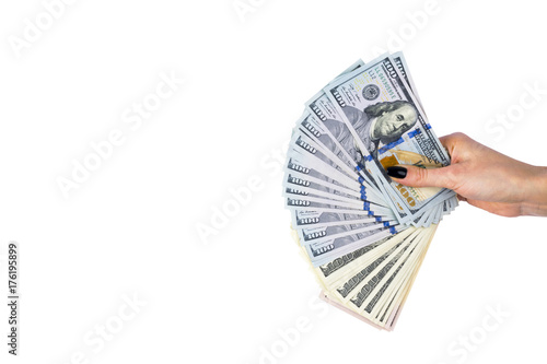 Hand with money isolated on white background. US Dollars in hand. Handful of money. Business woman offering money. Counting money. hand holds a bundle of dollar bills. Financial Credit concept.