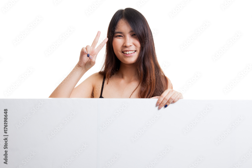 Young Asian woman show victory sign with blank sign. Young Asian woman show victory sign with blank sign.