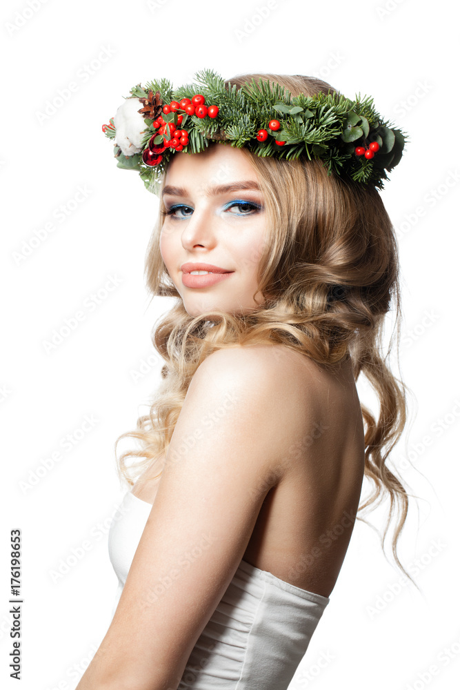 Naklejka premium New Year Girl. Happy Woman Fashion Model with Curly Hairstyle, Makeup and Christmas Wreath Isolated on White Background
