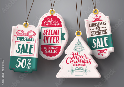 Christmas hanging sale tags vector set in white color with different shapes and greetings and discount text for christmas holiday marketing promotions. Vector illustration.
