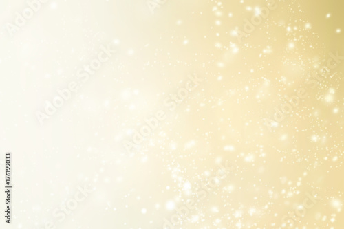 Elegant Christmas background with sparkling bokeh, snowflakes and copy place for text. Abstract golden boke background.
