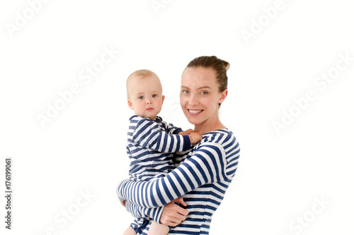 Mom is holding a son in vests