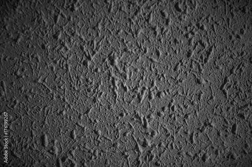 Closeup of dark grunge textured wall with  vignetting, may use as background with copy space for text.